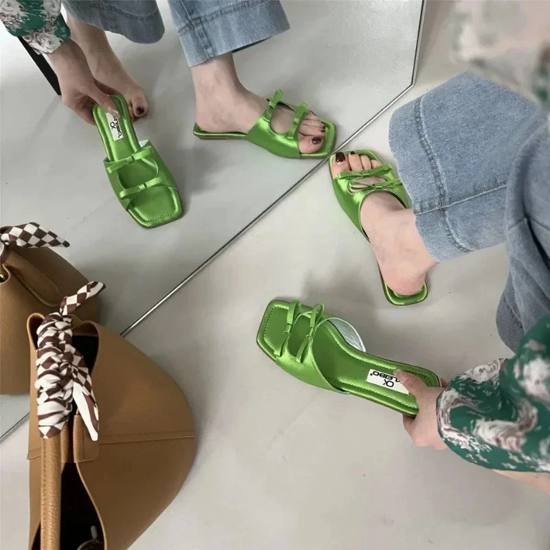Slippers With An Arch Bjlxn Summer Women Flat Slippers Candy Leather Women Simple Bow Shoes Open Toe Square Head Slippers Women 2024 New French Beach Shoes